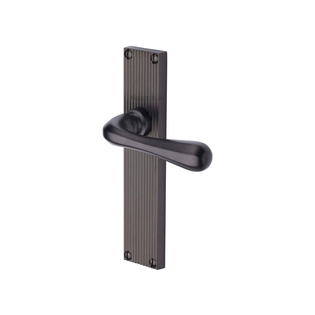 This is an image of a Heritage Brass - Charlbury Reeded Lever Latch Matt Bronze finish, rr3010-mb that is available to order from Trade Door Handles in Kendal.