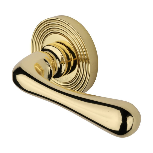 This is an image of a Heritage Brass - Door Handle Lever Latch on Round Rose Charlbury Reeded Design P, rr3022-pb that is available to order from Trade Door Handles in Kendal.