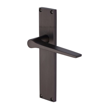 This is an image of a Heritage Brass - Gio Reeded Lever Latch Matt Bronze finish, rr4710-mb that is available to order from Trade Door Handles in Kendal.