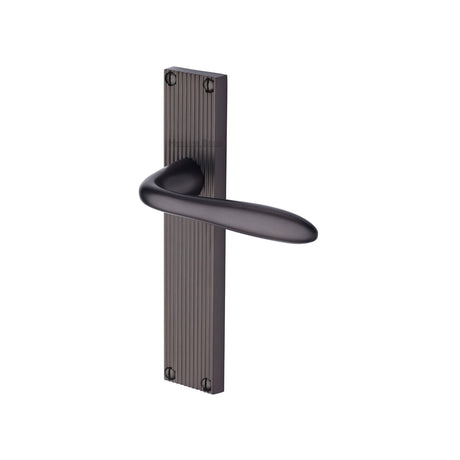 This is an image of a Heritage Brass - Sutton Reeded Lever Latch Matt Bronze finish, rr5010-mb that is available to order from Trade Door Handles in Kendal.