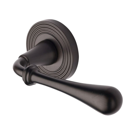 This is an image of a Heritage Brass - Door Handle Lever Latch on Round Rose Roma Reeded Design Matt B, rr7156-mb that is available to order from Trade Door Handles in Kendal.