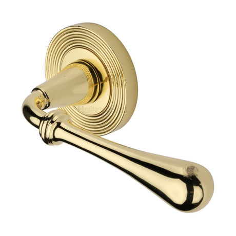 This is an image of a Heritage Brass - Door Handle Lever Latch on Round Rose Roma Reeded Design Polished B, rr7156-pb that is available to order from Trade Door Handles in Kendal.