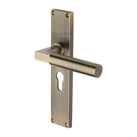 This is an image of a Heritage Brass - Bauhaus Reeded Euro Profile Antique Brass finish, rr7348-at that is available to order from Trade Door Handles in Kendal.