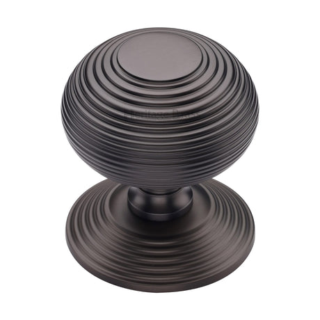 This is an image of a Heritage Brass - Centre Door Knob Reeded Design 3 1/2 Matt Bronze Finish, rr906-mb that is available to order from Trade Door Handles in Kendal.
