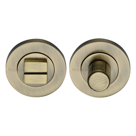 This is an image of a Heritage Brass - Thumbturn & Emergency Release Antique Brass Finish, rs2030-at that is available to order from Trade Door Handles in Kendal.