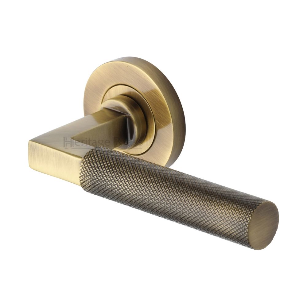 This is an image of a Heritage Brass - Door Handle Lever on Rose Signac (Knurled Bauhaus) Design Antique, rs2260-at that is available to order from Trade Door Handles in Kendal.