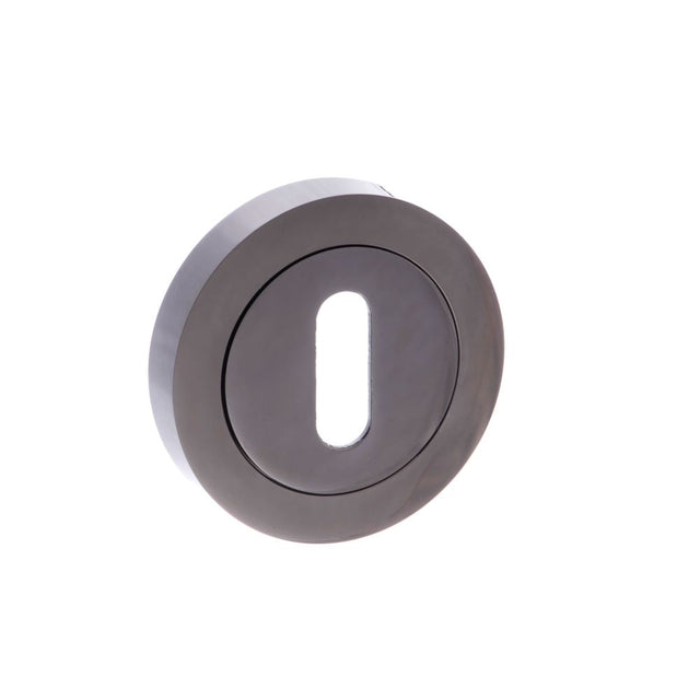 This is an image of STATUS Key Escutcheon on Round Rose - Black Nickel available to order from Trade Door Handles.