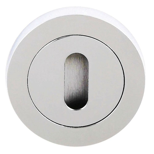 This is an image of STATUS Key Escutcheon on Round Rose - Polished Chrome available to order from Trade Door Handles.