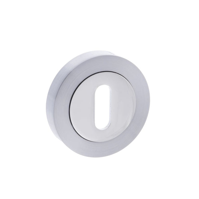 This is an image of STATUS Key Escutcheon on Round Rose - Satin Chrome/Polished Chrome available to order from Trade Door Handles.