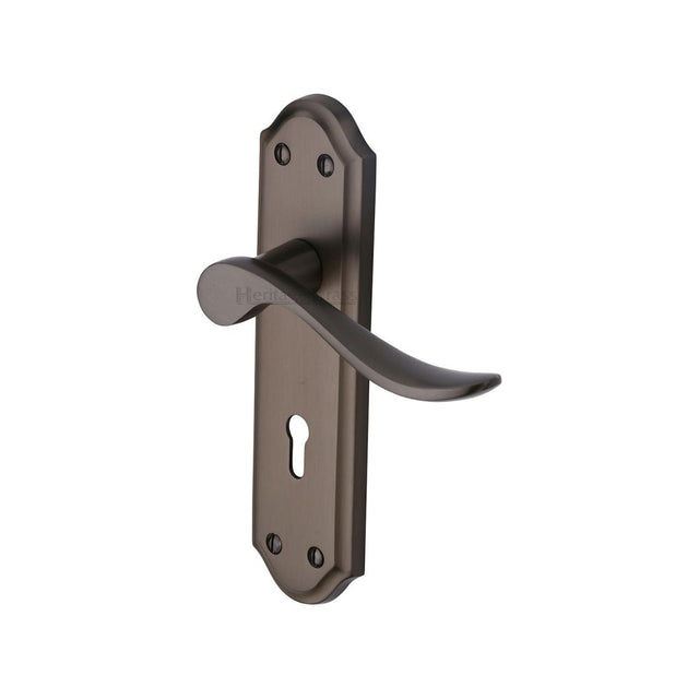 This is an image of a Heritage Brass - Door Handle Lever Lock Sandown Design Matt Bronze Finish, san1400-mb that is available to order from Trade Door Handles in Kendal.