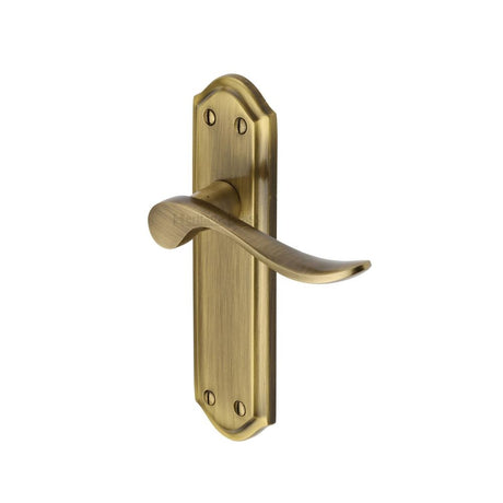 This is an image of a Heritage Brass - Door Handle Lever Latch Sandown Design Antique Brass Finish, san1410-at that is available to order from Trade Door Handles in Kendal.
