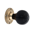 This is an image of Spira Brass - Ebony Beehive Rim/Mortice Door Knob Aged Brass   available to order from trade door handles, quick delivery and discounted prices.