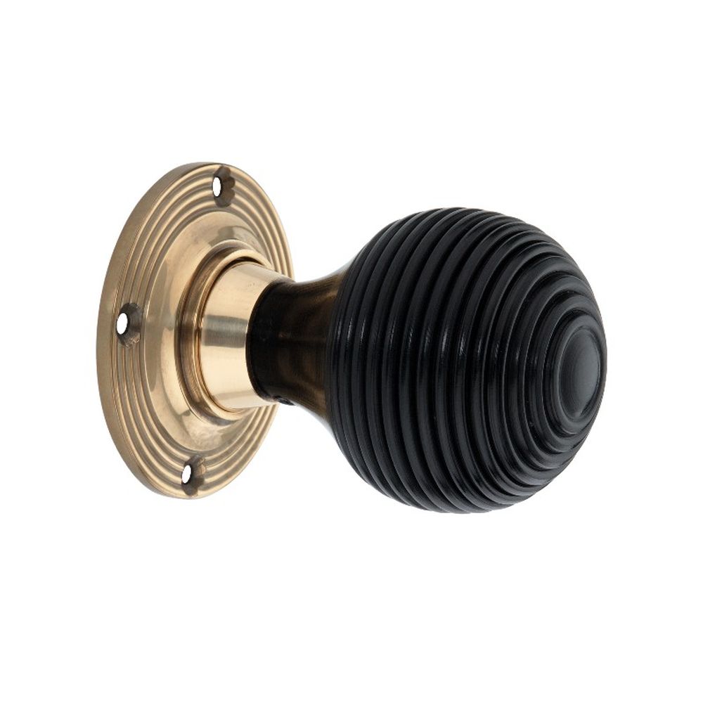 This is an image of Spira Brass - Ebony Beehive Rim/Mortice Door Knob Aged Brass   available to order from trade door handles, quick delivery and discounted prices.