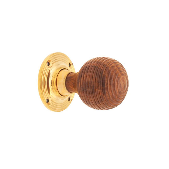 This is an image of Spira Brass - Rosewood Beehive Rim/Mortice Door Knob Polished Brass   available to order from trade door handles, quick delivery and discounted prices.