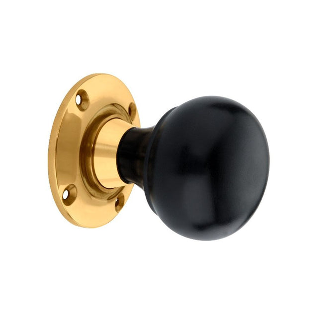 This is an image of Spira Brass - Ebony Bun Rim/Mortice Door Knob Polished Brass   available to order from trade door handles, quick delivery and discounted prices.