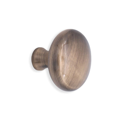 This is an image of Spira Brass - Mushroom 38mm Cupboard Knob Antique   available to order from trade door handles, quick delivery and discounted prices.