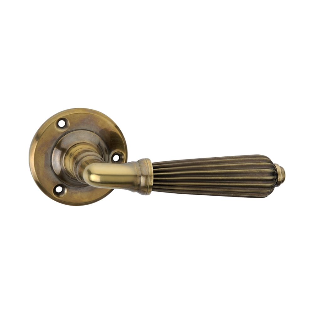 This is an image of Spira Brass - Regency Lever Door Handle Aged Brass   available to order from trade door handles, quick delivery and discounted prices.