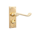 This is an image of Spira Brass - Victorian Scroll Privacy Lever Handle 115mm Polished Brass   available to order from trade door handles, quick delivery and discounted prices.