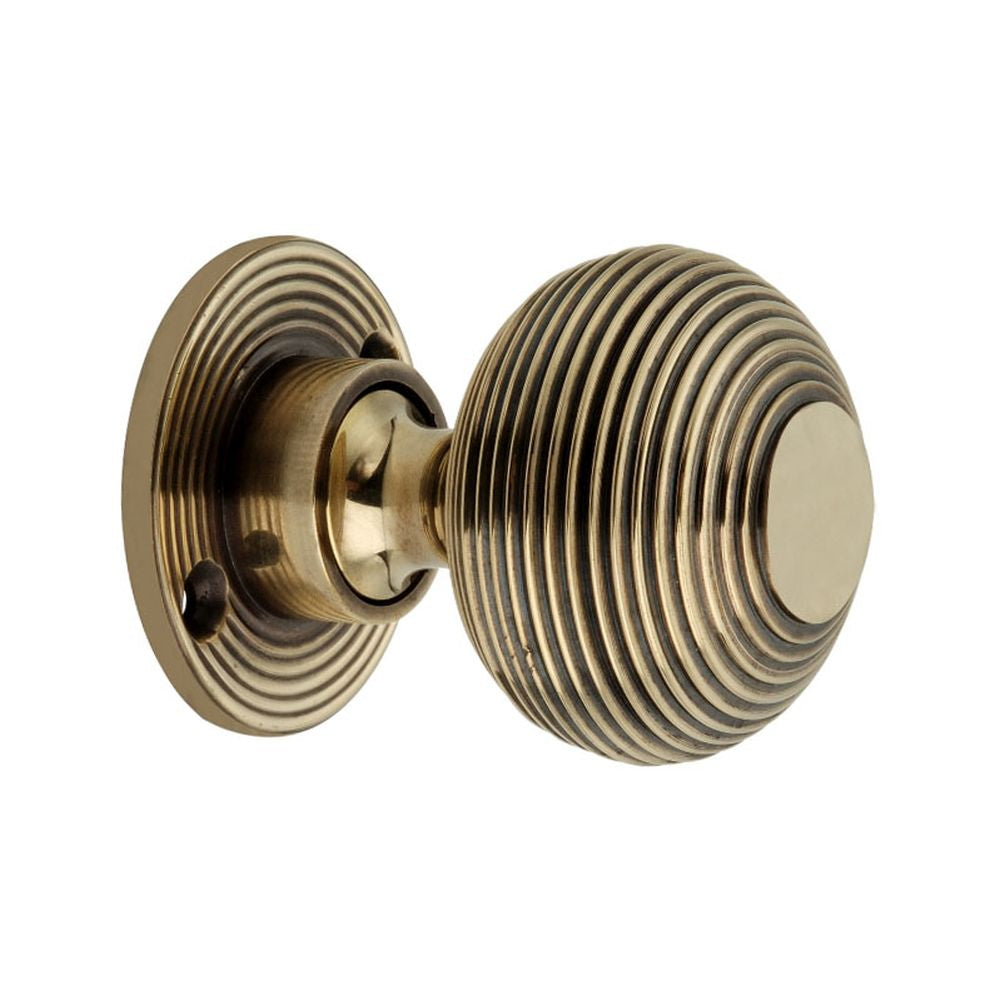 This is an image of Spira Brass - Beehive 50mm Rim/Mortice Door Knob Aged Brass   available to order from trade door handles, quick delivery and discounted prices.