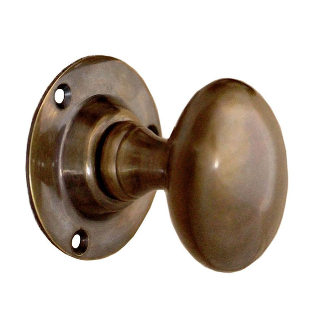 This is an image of Spira Brass - Oval Mortice Door Knob Antique   available to order from trade door handles, quick delivery and discounted prices.