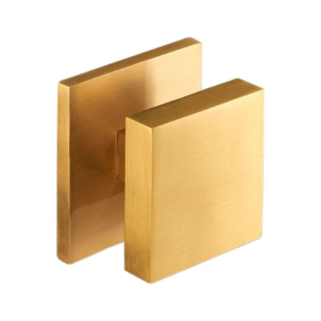 This is an image of Spira Brass - Square Centre Door Knob Satin Brass   available to order from trade door handles, quick delivery and discounted prices.