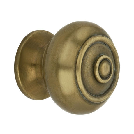 This is an image of Spira Brass - Bloxwich Small 30mm Cupboard Knob Aged Brass   available to order from trade door handles, quick delivery and discounted prices.