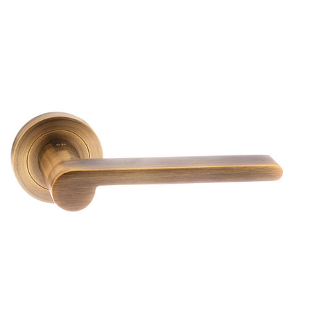 High quality image of Senza Pari Darrio Designer Lever on Round Rose - Weathered Antique Bronze | Sku. spm218wab | available to order from Trade Door Handles in Kendal.