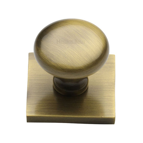 This is an image of a Heritage Brass - Cabinet Knob Victorian Round Design with Square Backplate 32mm, sq113-at that is available to order from Trade Door Handles in Kendal.