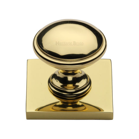 This is an image of a Heritage Brass - Cabinet Knob Domed Design with Square Backplate 32mm Polished Brass, sq3950-pb that is available to order from Trade Door Handles in Kendal.