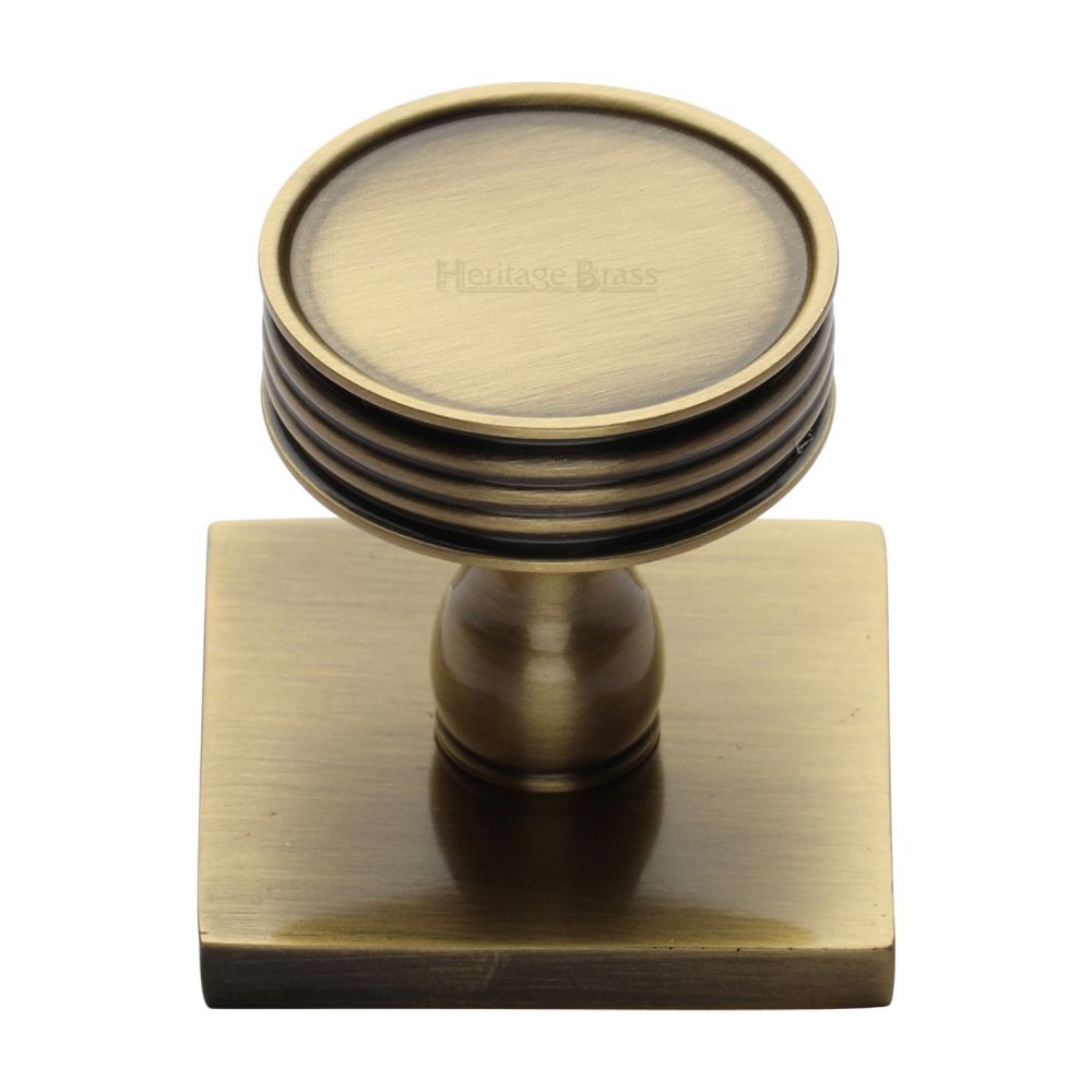 This is an image of a Heritage Brass - Cabinet Knob Venetian Design with Square Backplate 32mm Antique Br, sq4547-at that is available to order from Trade Door Handles in Kendal.