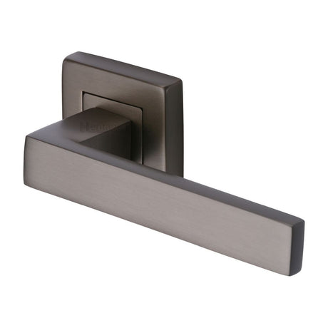 This is an image of a Heritage Brass - Door Handle Lever Latch on Square Rose Delta Sq Design Matt Bro, sq5420-mb that is available to order from Trade Door Handles in Kendal.