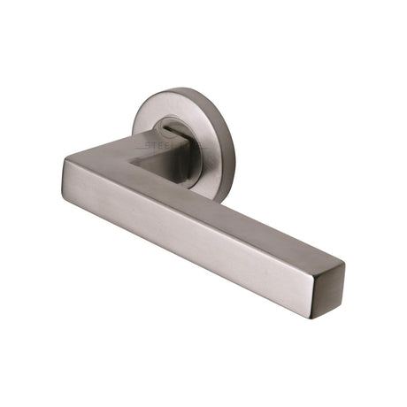 This is an image of a Steel Line Door Handle Lever Latch on Round Rose Tube Design Satin Stainless Steel finish, ss-601-s that is available to order from Trade Door Handles in Kendal.