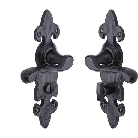 This is an image of a The Tudor Collection - Door Handle for Bathroom Fleur de Lys Design Black Iron, tc220 that is available to order from Trade Door Handles in Kendal.