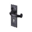 This is an image of a The Tudor Collection - Door Handle Lever Lock Colonial Design Black Iron, tc300 that is available to order from Trade Door Handles in Kendal.