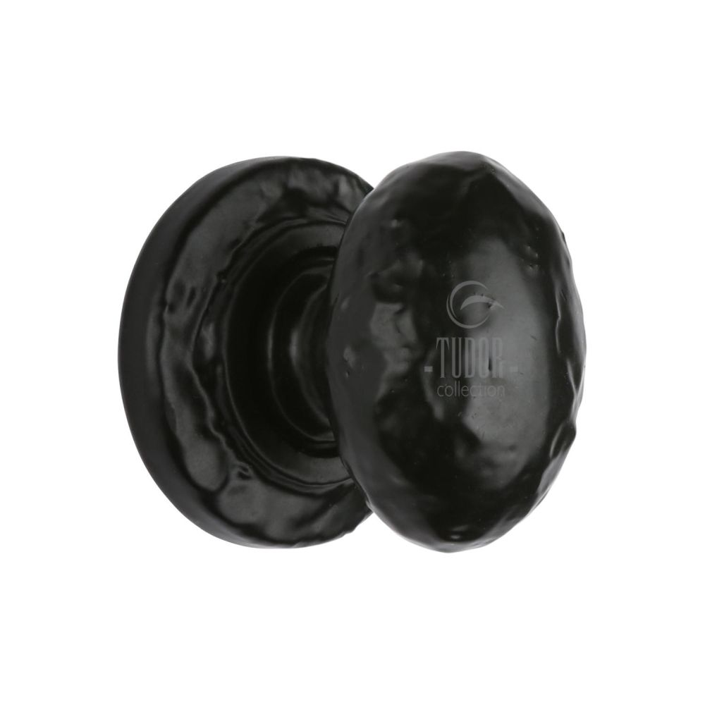 This is an image of a The Tudor Collection - Cabinet Knob Rustic Oval Design 38mm Black Iron, tc534-38 that is available to order from Trade Door Handles in Kendal.