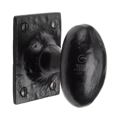 This is an image of a The Tudor Collection - Mortice Knob on Rose Oval Design Black Iron, tc550 that is available to order from Trade Door Handles in Kendal.