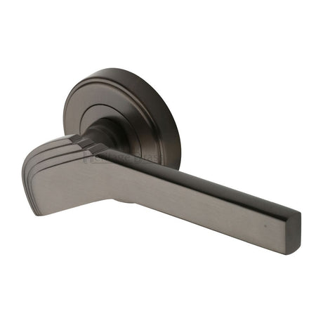 This is an image of a Heritage Brass - Door Handle Lever on Rose Tiffany Design Matt Bronze Finish, tif1926-mb that is available to order from Trade Door Handles in Kendal.