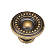 This is an image of a M.Marcus - Beaded Round Knob 035mm Distressed Brass Finish, tk4404-035-dbs that is available to order from Trade Door Handles in Kendal.