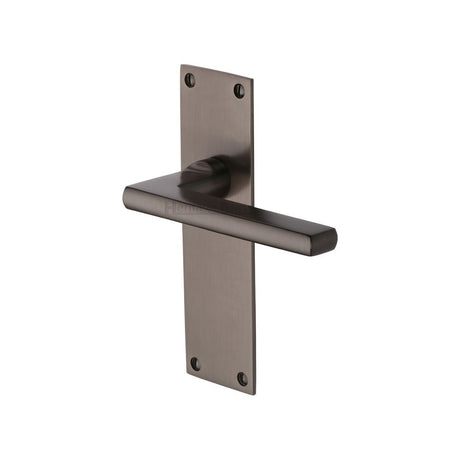 This is an image of a Heritage Brass - Door Handle Lever Latch Trident Design Matt Bronze Finish, tri1310-mb that is available to order from Trade Door Handles in Kendal.