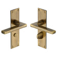 This is an image of a Heritage Brass - Door Handle Bathroom Set Trident Design Antique Brass Finish, tri1330-at that is available to order from Trade Door Handles in Kendal.