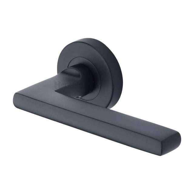 This is an image of a Heritage Brass - Door Handle Lever Latch on Round Rose Trident Design Matt Black, tri1352-bkmt that is available to order from Trade Door Handles in Kendal.