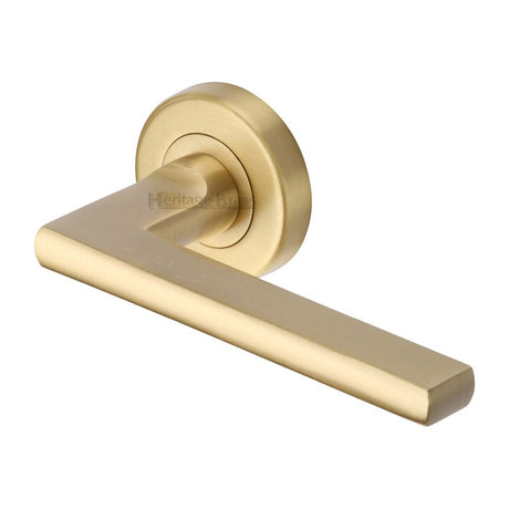 This is an image of a Heritage Brass - Door Handle Lever Latch on Round Rose Trident Design Satin Brass, tri1352-sb that is available to order from Trade Door Handles in Kendal.