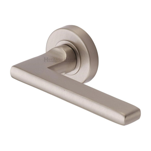 This is an image of a Heritage Brass - Door Handle Lever Latch on Round Rose Trident Design Satin Nicke, tri1352-sn that is available to order from Trade Door Handles in Kendal.