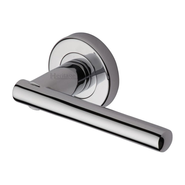 This is an image of a Heritage Brass - Door Handle Lever Latch on Round Rose Challenger Design Polished Ch, v1001-pc that is available to order from Trade Door Handles in Kendal.