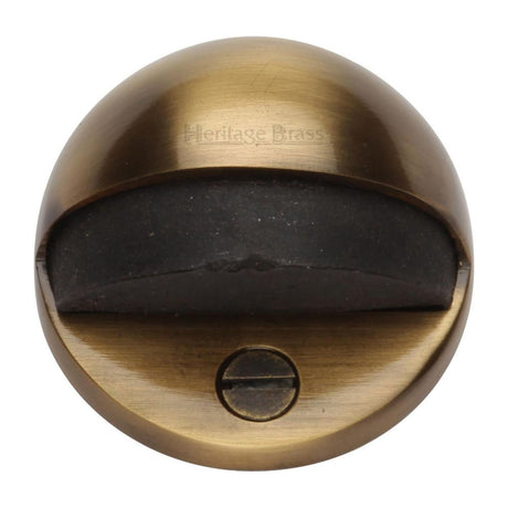 This is an image of a Heritage Brass - Shielded Door Stop Antique Brass Finish, v1080-at that is available to order from Trade Door Handles in Kendal.