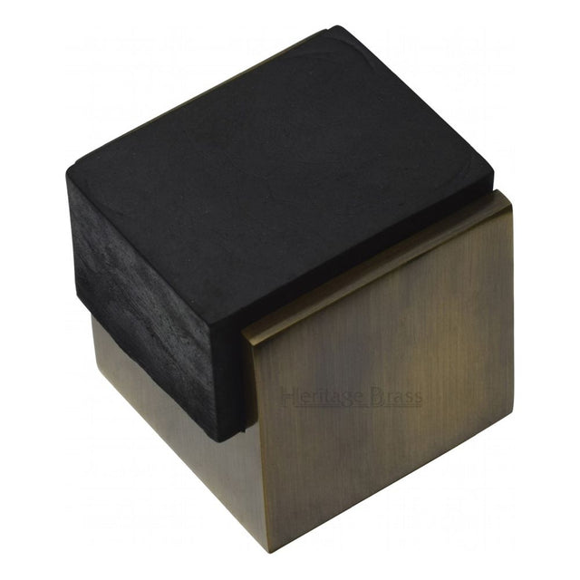 This is an image of a Heritage Brass - Door Stop Square Floor Mounted Design Antique Brass Finish, v1082-at that is available to order from Trade Door Handles in Kendal.