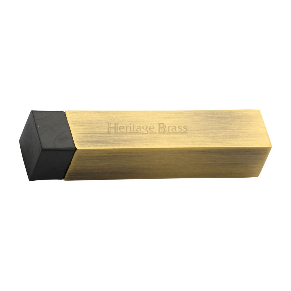 This is an image of a Heritage Brass - Door Stop Square Wall Mounted Design Antique Brass Finish, v1084-at that is available to order from Trade Door Handles in Kendal.