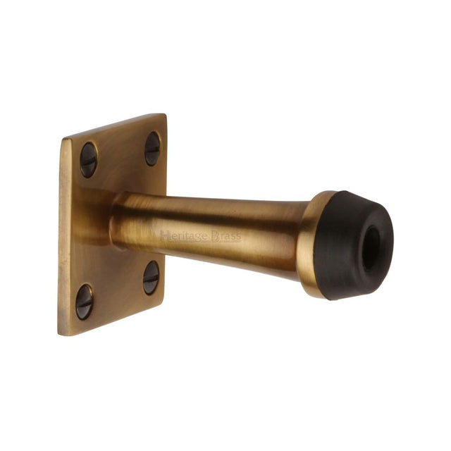 This is an image of a Heritage Brass - Wall Mounted Door Stop 3" Antique Brass Finish, v1190-76-at that is available to order from Trade Door Handles in Kendal.