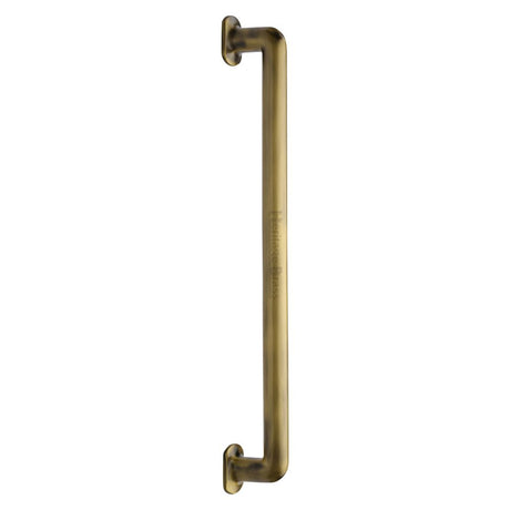 This is an image of a Heritage Brass - Door Pull Handle Traditional Design 482mm Antique Brass Finish, v1376-482-at that is available to order from Trade Door Handles in Kendal.