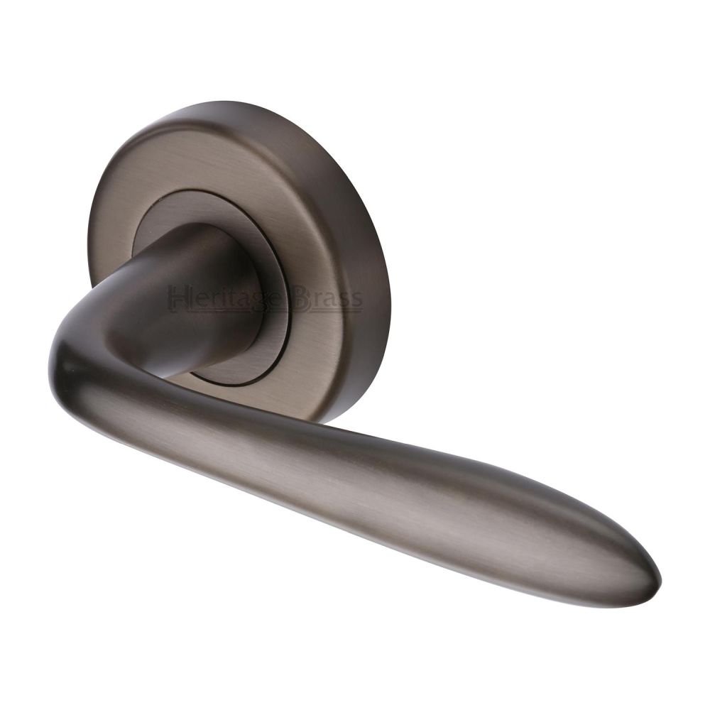 This is an image of a Heritage Brass - Door Handle Lever Latch on Round Rose Sutton Design Matt Bronze, v1750-mb that is available to order from Trade Door Handles in Kendal.